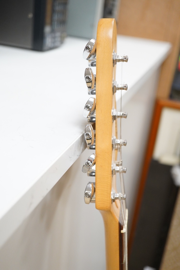 A Fender Squire electric guitar, with a Kinsman soft case, together with a Peavey VYPYR 15W modelling amplifier